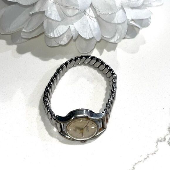 Wristwatch photographed by a marketplace seller against a plain background